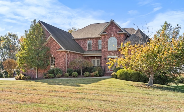 view of property featuring a front yard