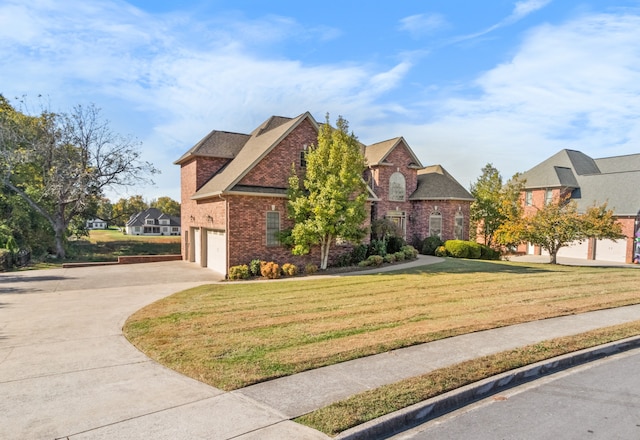 view of front of home featuring a front lawn and a garage