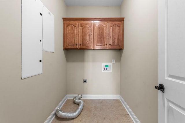 306 Gray Hawk Trl, Clarksville, TN 37043 - laundry area featuring cabinet space, washer hookup, electric dryer hookup, baseboards, and tile patterned flooring