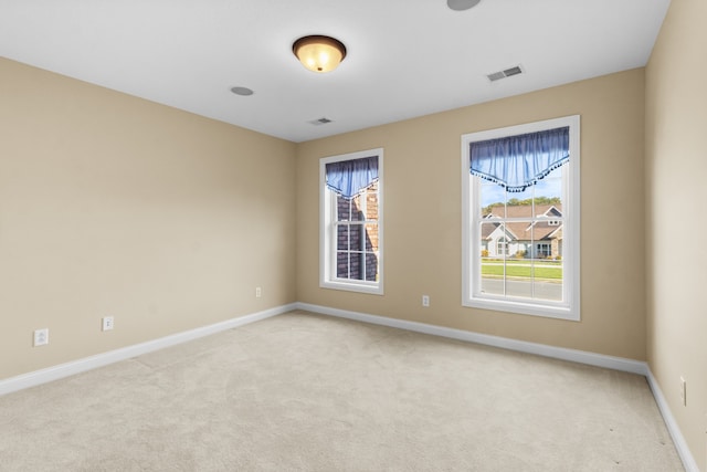 empty room with light colored carpet