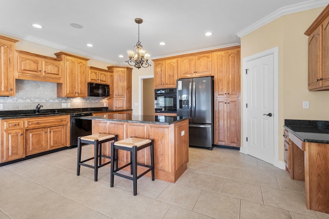 306 Gray Hawk Trl, Clarksville, TN 37043 - kitchen with decorative backsplash, a chandelier, a center island, black appliances, and recessed lighting