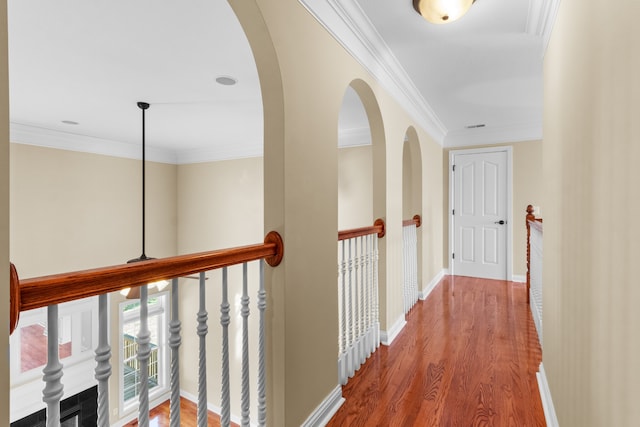 hallway featuring ornamental molding and wood-type flooring