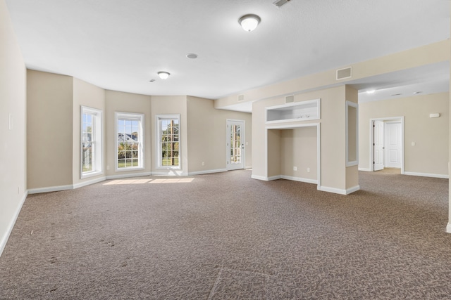 unfurnished living room with carpet floors