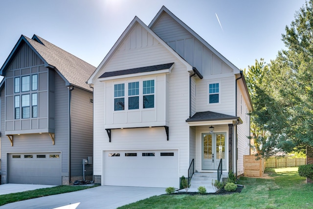 view of front of house featuring a front yard and a garage