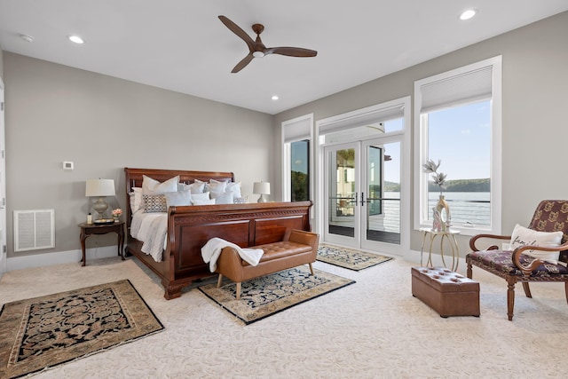 bedroom with access to outside, french doors, light colored carpet, and ceiling fan