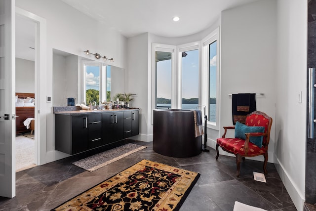 bathroom featuring vanity and a water view