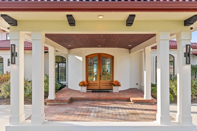 entrance to property with french doors and covered porch