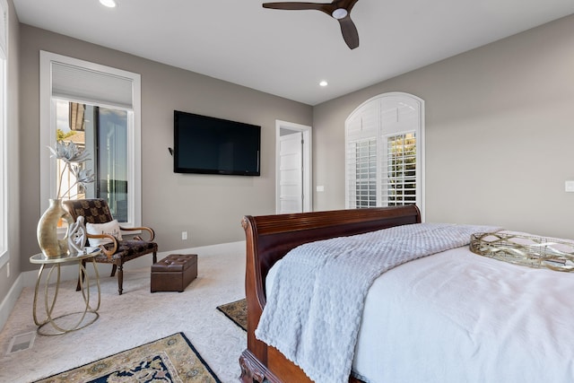 carpeted bedroom with ceiling fan