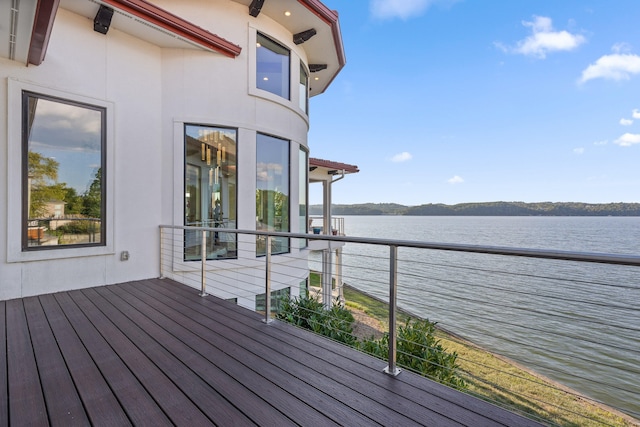 wooden terrace with a water view