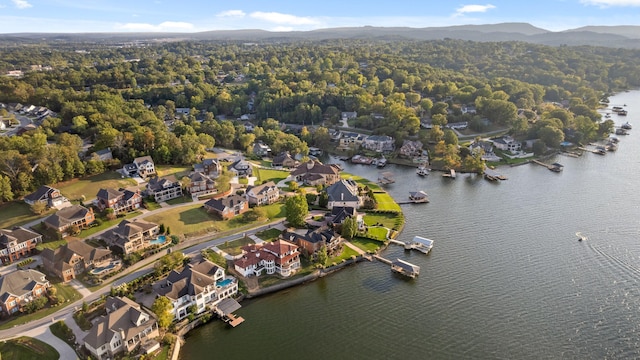 drone / aerial view featuring a water and mountain view