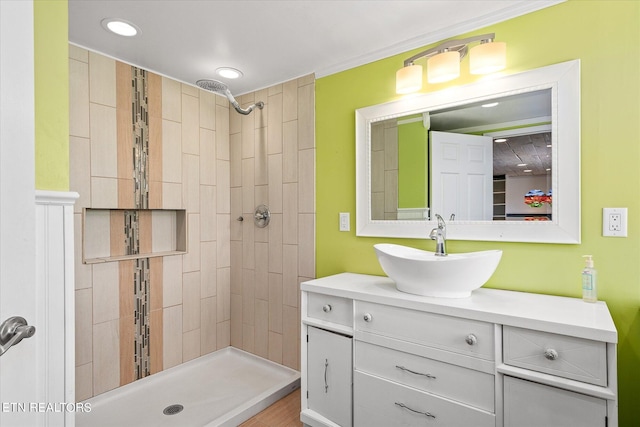 bathroom featuring vanity and a tile shower