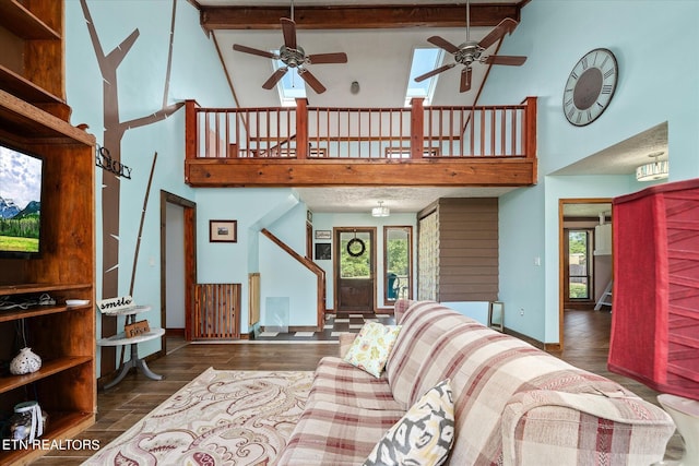 living room with beamed ceiling, dark hardwood / wood-style floors, high vaulted ceiling, and ceiling fan