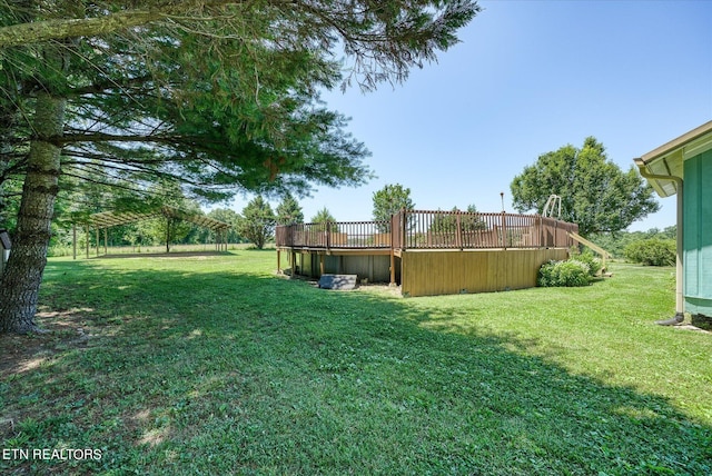 view of yard with a wooden deck
