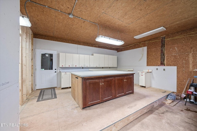 kitchen with a kitchen island and light countertops