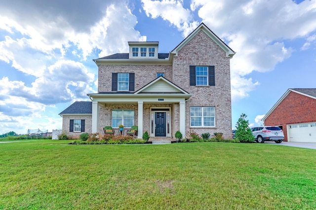 craftsman-style house with a front yard, a garage, and a porch