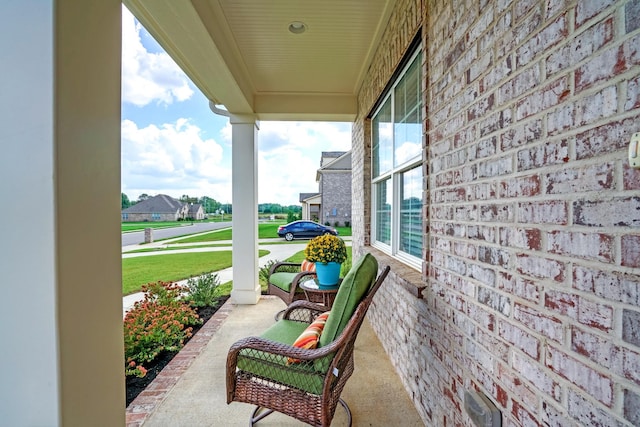 view of patio featuring a porch