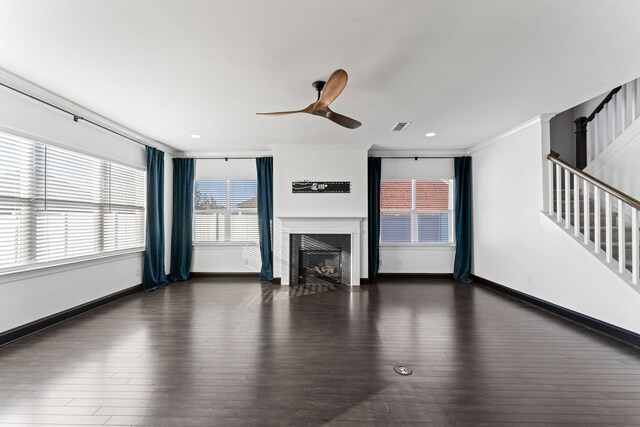 unfurnished living room with ornamental molding, ceiling fan, and dark hardwood / wood-style flooring