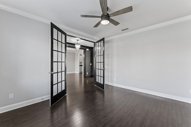 spare room featuring french doors, dark hardwood / wood-style floors, ceiling fan, and crown molding