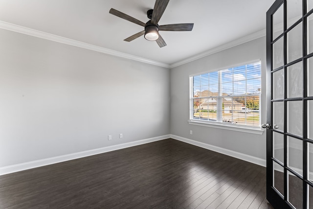 spare room with crown molding, dark hardwood / wood-style flooring, and ceiling fan