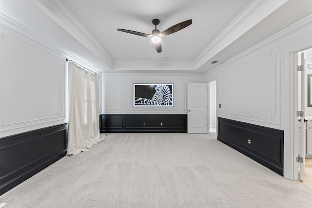 interior space featuring light carpet, crown molding, and ceiling fan