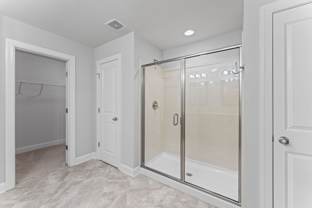 bathroom featuring walk in shower