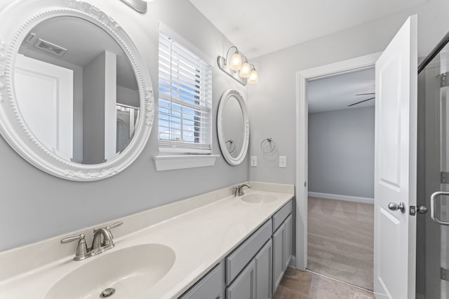 bathroom with vanity and tile patterned flooring