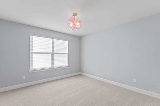 spare room featuring carpet floors