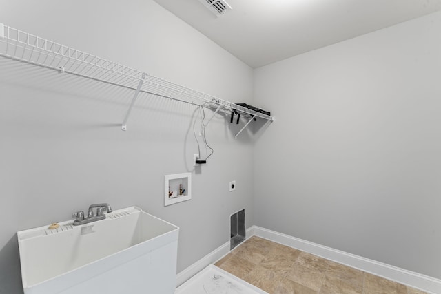 laundry area featuring sink, hookup for a washing machine, and electric dryer hookup