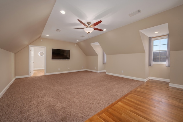 bonus room with ceiling fan, wood-type flooring, and vaulted ceiling