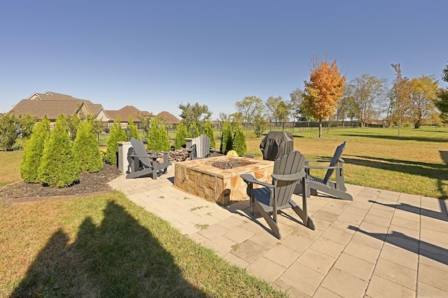 view of patio / terrace with an outdoor fire pit