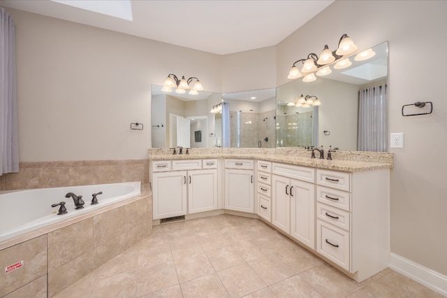 bathroom with vanity, tile patterned floors, and separate shower and tub