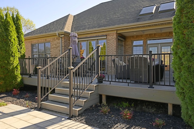 rear view of house with a wooden deck