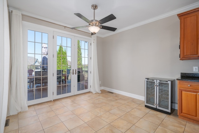 doorway to outside with crown molding, french doors, ceiling fan, wine cooler, and light tile patterned floors