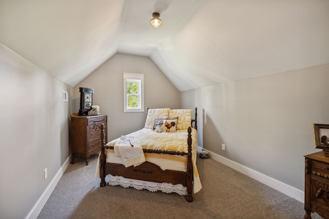 carpeted bedroom with vaulted ceiling