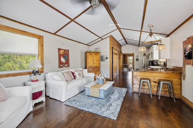 living room with lofted ceiling, dark wood-type flooring, sink, and ceiling fan