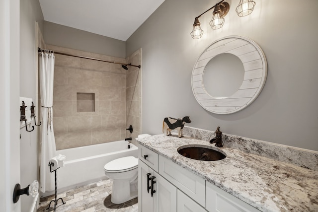 full bathroom featuring toilet, shower / bath combination with curtain, and vanity