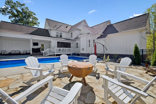 view of patio / terrace with a fenced in pool