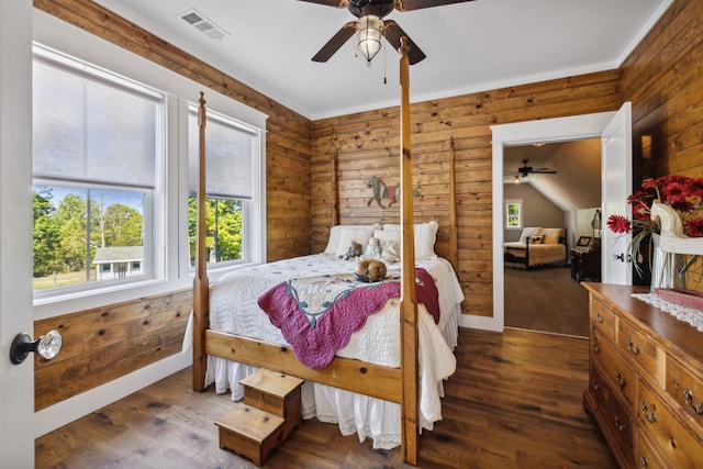 bedroom featuring ceiling fan, vaulted ceiling, and dark hardwood / wood-style floors