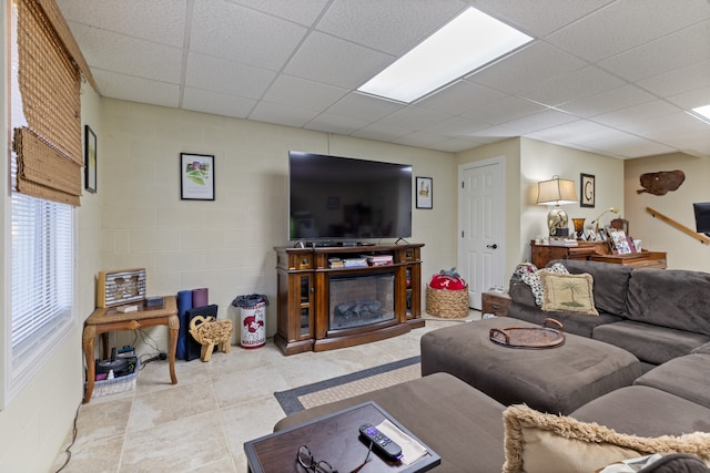 living room with a paneled ceiling