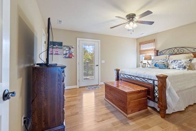 bedroom featuring ceiling fan, light hardwood / wood-style floors, and access to exterior