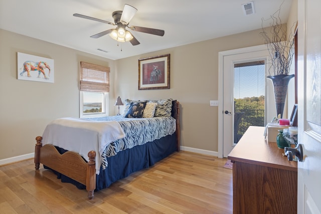 bedroom with light hardwood / wood-style flooring, access to exterior, and ceiling fan