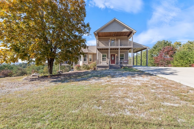 view of front of home with a carport and a front yard