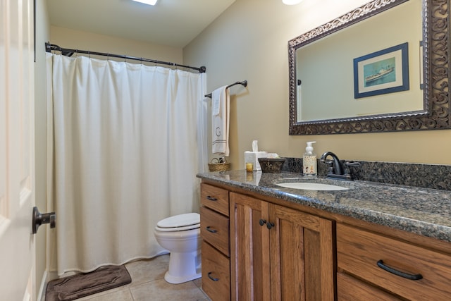 bathroom with vanity, curtained shower, toilet, and tile patterned floors