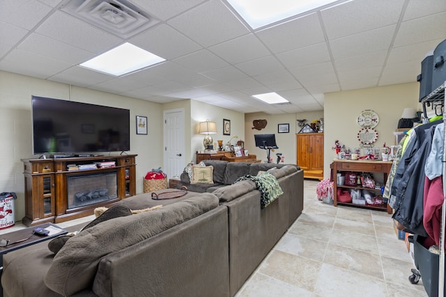 living room with a drop ceiling