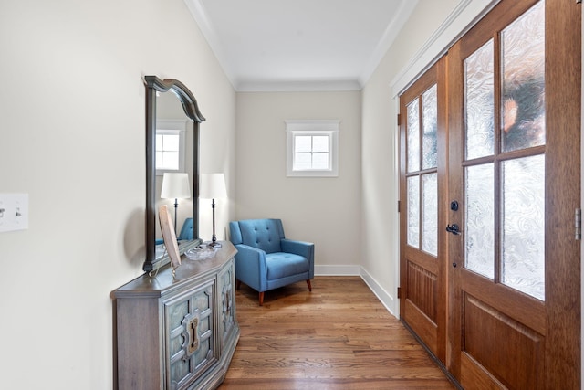 foyer featuring crown molding, french doors, and dark wood-type flooring