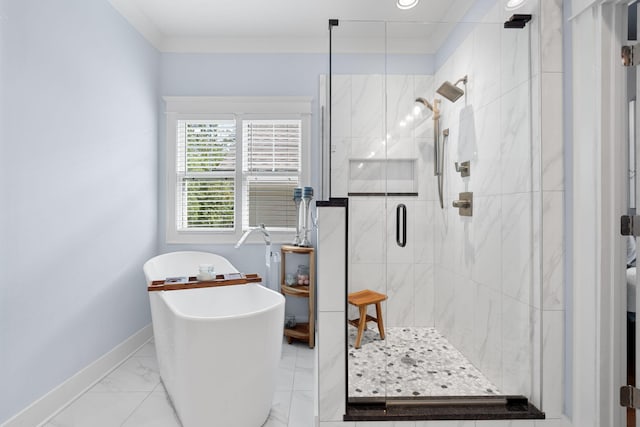 bathroom featuring ornamental molding and shower with separate bathtub