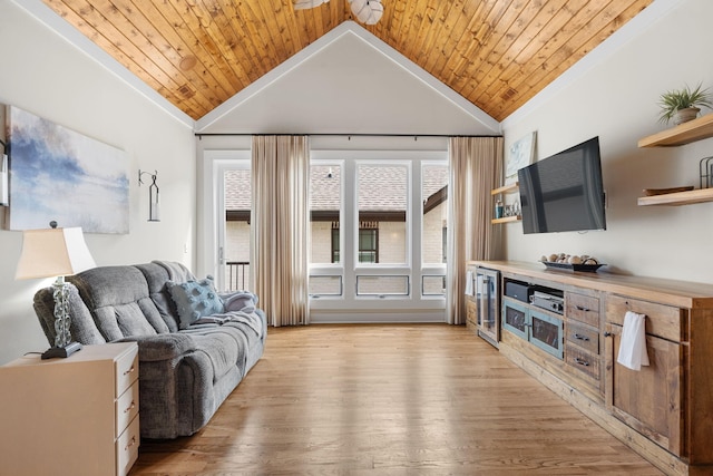 living room with lofted ceiling, light hardwood / wood-style flooring, and wooden ceiling