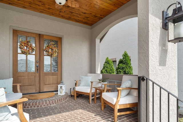 view of exterior entry featuring french doors