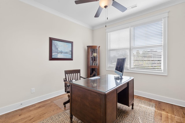 home office with ceiling fan, ornamental molding, and light hardwood / wood-style flooring