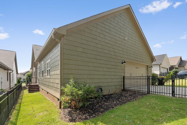 view of home's exterior with a yard and a garage